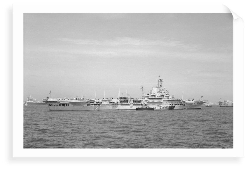 Aircraft carrier HMS 'Illustrious' (1939) in June 1953, anchored in Line F at Spithead for the Coronation Review. The aircraft lighter 'R.N.AIR' is alongside by unknown