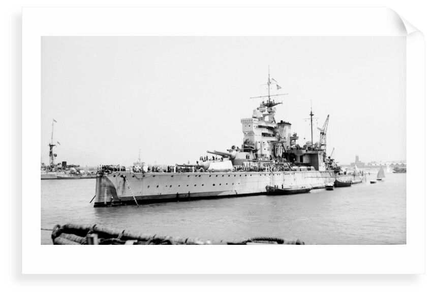 Battleship HMS 'Valiant' (1914) anchored in Alexandria harbour taking on ammunition by unknown