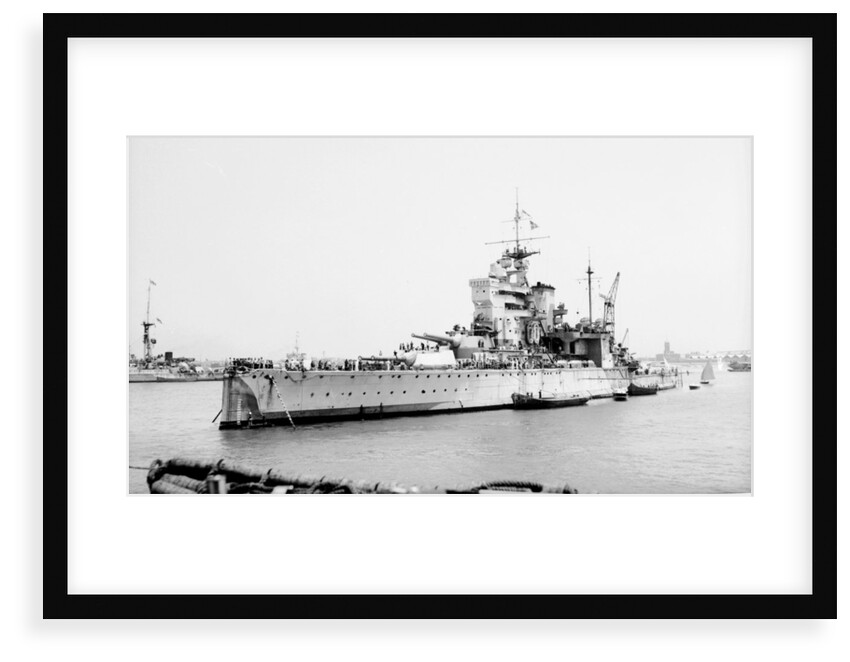 Battleship HMS 'Valiant' (1914) anchored in Alexandria harbour taking on ammunition by unknown
