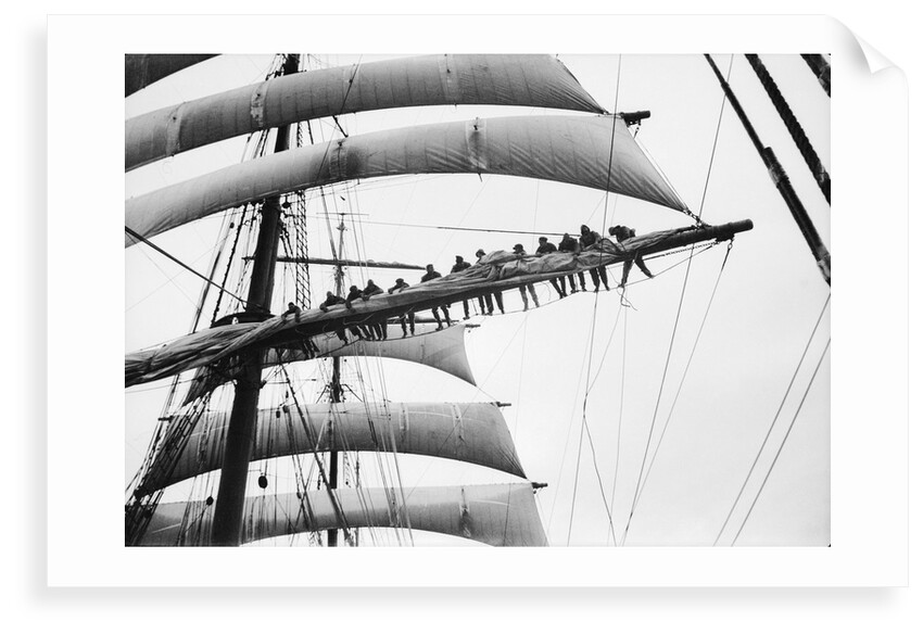 Out on the yard, furling the sail by Alan Villiers