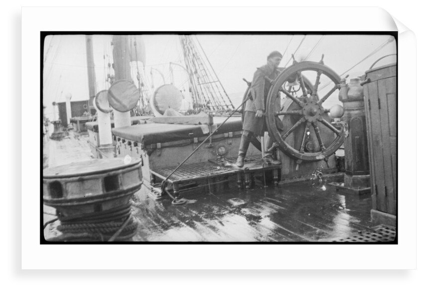 The 'Herzogin Cecile' (Fi, 1902) a seaman at the midships wheel in heavy weather. The helmsman is wearing a safety harness by unknown