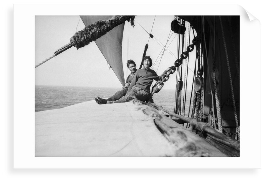 The girl stowaway seated on the main yard with the third mate by Alan Villiers
