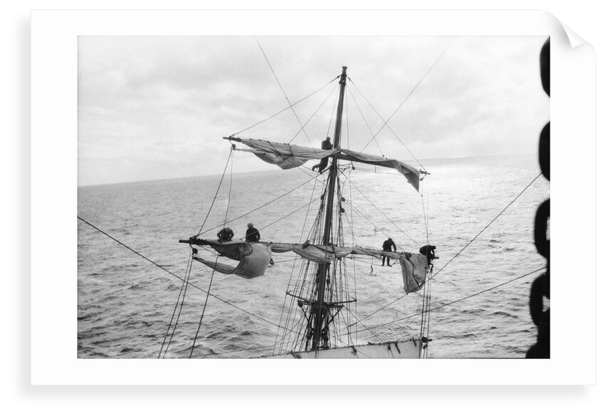 Aloft on the Mizzen furling the blown-out sails by Alan Villiers