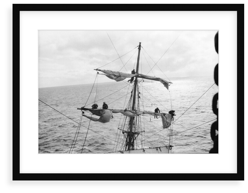 Aloft on the Mizzen furling the blown-out sails by Alan Villiers