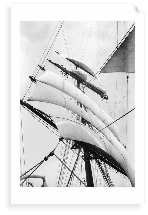 High aloft, taking in sail as the storm increases by Alan Villiers