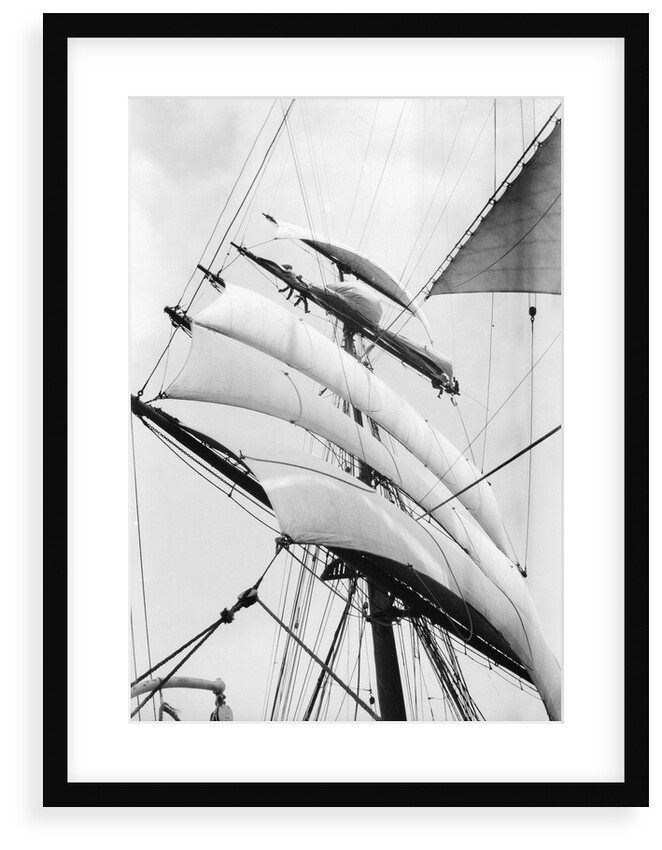 High aloft, taking in sail as the storm increases by Alan Villiers