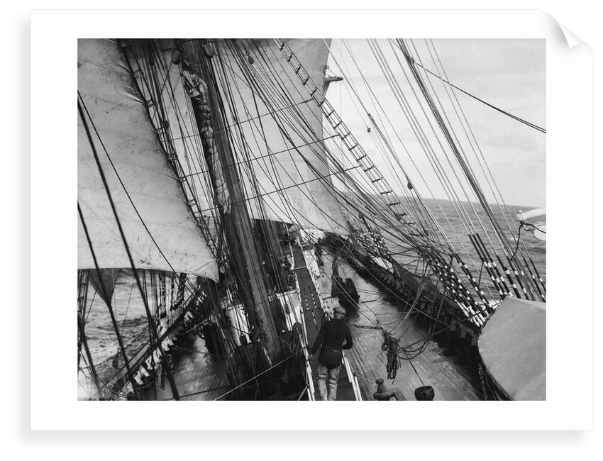 Unbending a topsail by Alan Villiers