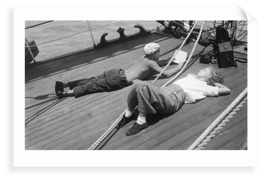 Elizabeth Jacobsen and Moses relaxing on the forecastle head by Alan Villiers