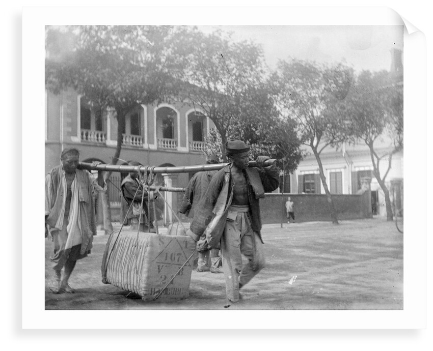 Two Chinese men carrying a load suspended from a pole between them by Kenneth Hurlstone Jones