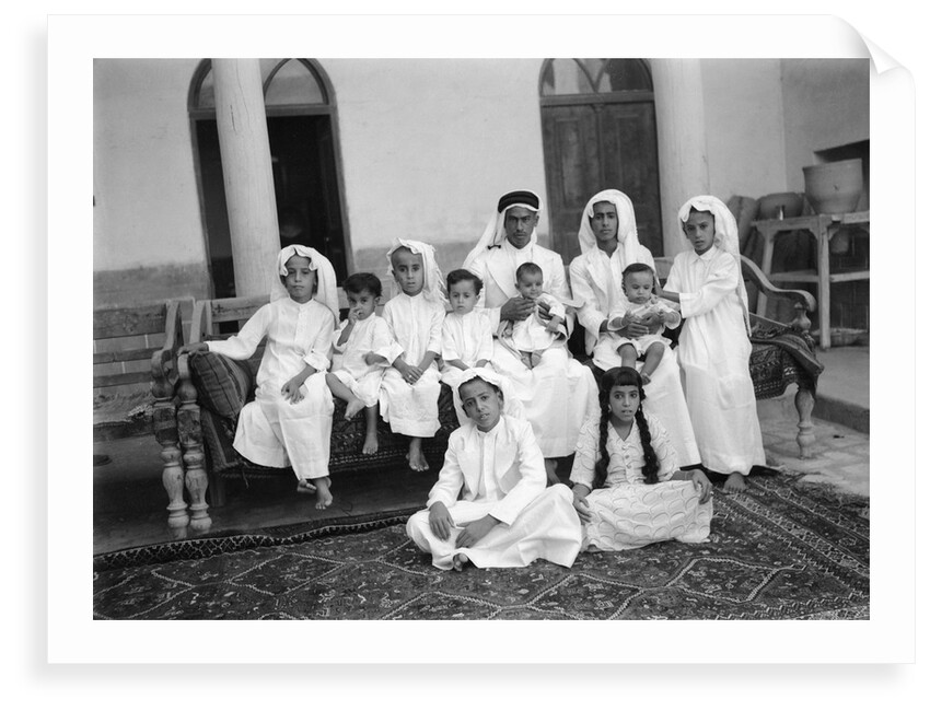 A Kuwaiti merchant at home with his family by Alan Villiers