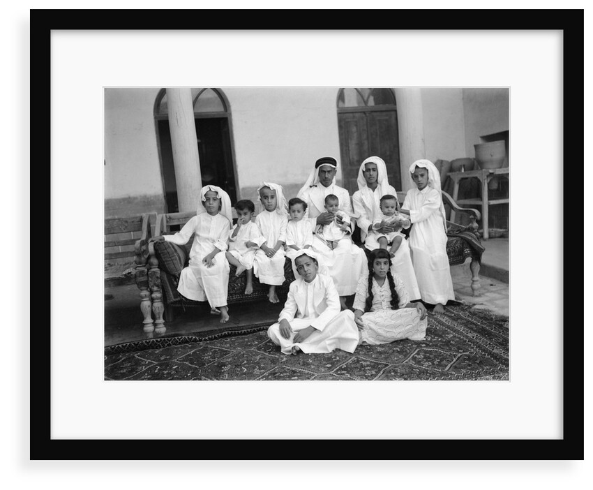 A Kuwaiti merchant at home with his family by Alan Villiers