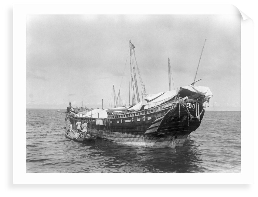 A baggala at anchor off Zanzibar discharging her cargo by Alan Villiers
