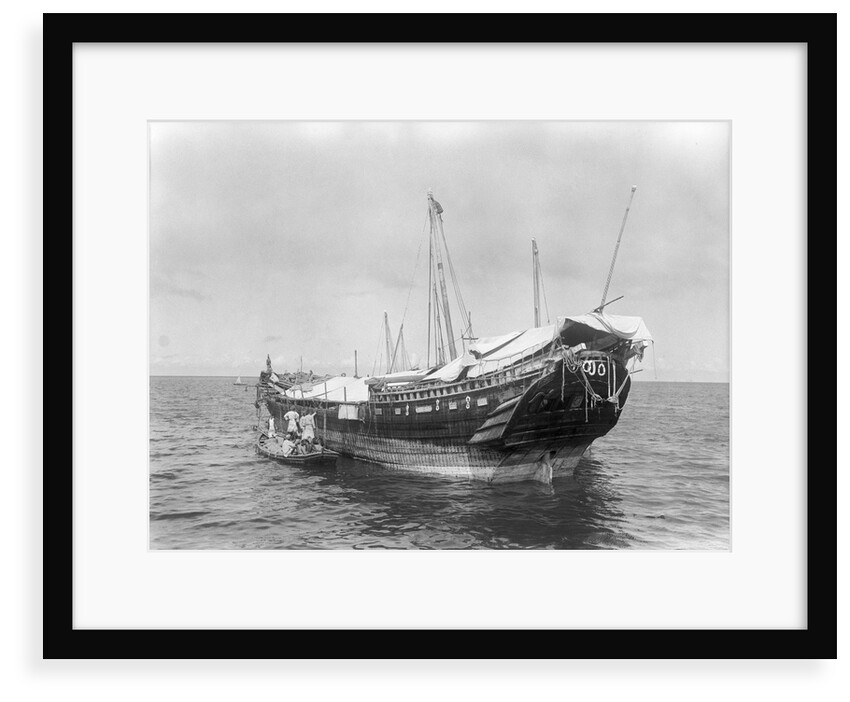 A baggala at anchor off Zanzibar discharging her cargo by Alan Villiers