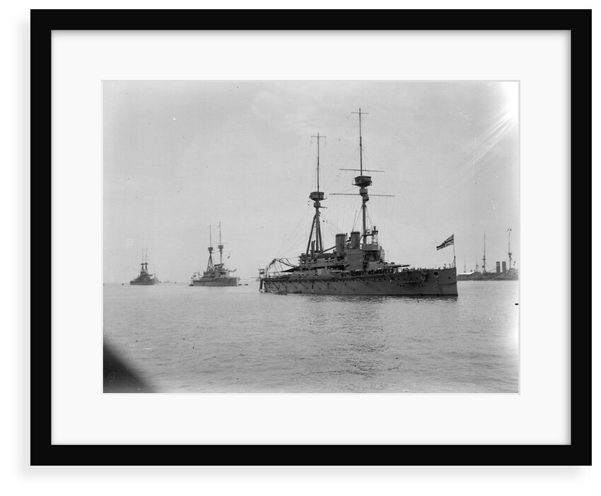 Battleship HMS 'Agamemnon' (1906) at anchor at Spithead, with awning rigged aft and 'Lord Nelson' astern of her by unknown