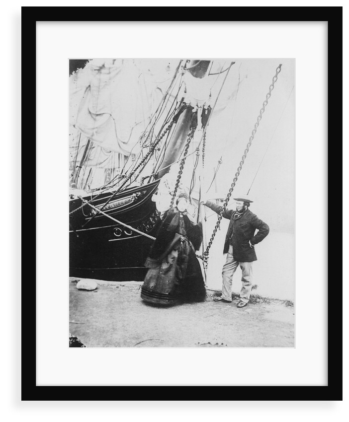 Photograph of John and Ann Gambles standing by the bow of the 'Ann Gambles' barque by unknown