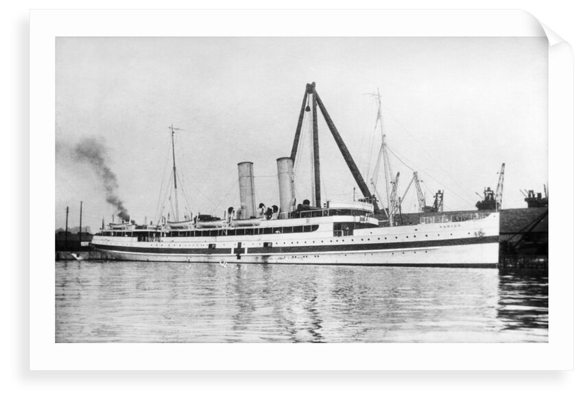 The cross channel turbine steamer 'Munich' (Br 1908) as a hospital ship at quayside, under sheerlegs by Anonymous
