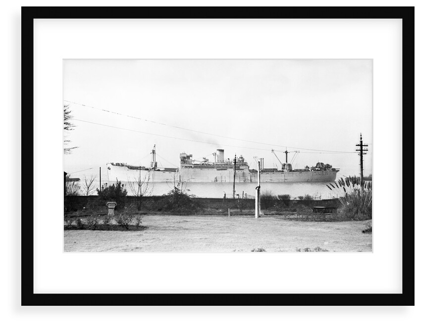 Cargo liner 'Manchester Port' (1935) under tow with topmasts struck by unknown