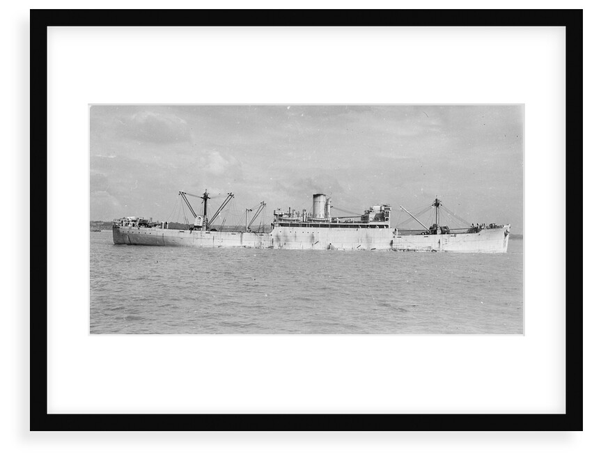 The 'Manchester Progress' (Br, 1938) under tow in port, topmasts struck by unknown