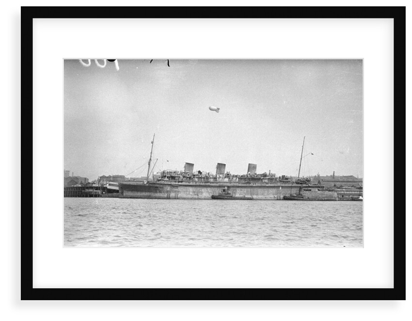 'Monarch of Bermuda' (1931) alongside in the River Mersey in 1942-1943, probably refitting as a mercantile LSI(L) by unknown