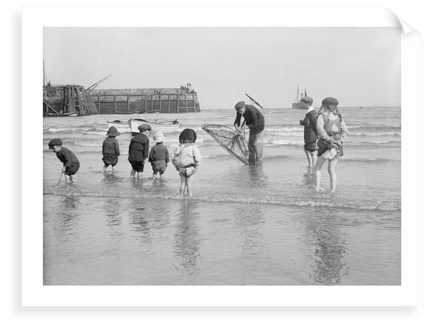 Boys and girls watch intently as a local fisherman wields his net in Scarborough, Yorkshire by Samuel Coupe Fox