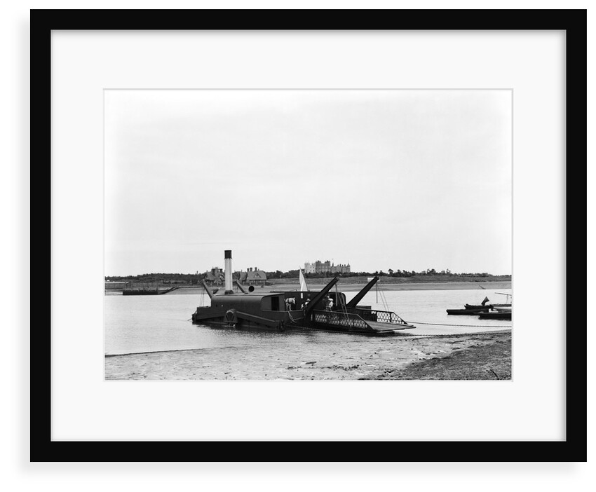 The steam chain ferry 'Lady Quilter' (1894) on the Felixstowe side of the River Deben, with Bawdsey Manor in the background by Smiths Suitall Ltd.