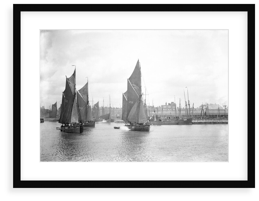 The sailing trawlers 'LT325', 'LT653' and 'LT37' leaving the outer harbour at Lowestoft, Suffolk, taken from the end of the breakwater by Smiths Suitall Ltd.