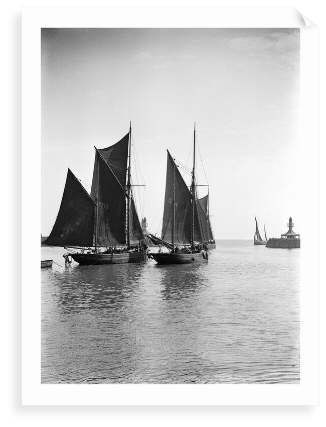 The trawler 'Refuge' (1896) [LT715] under sail, close to the trawler 'Greyhound' (1905) [LT404], in the outer harbour outward bound at Lowestoft, Suffolk by Smiths Suitall Ltd.