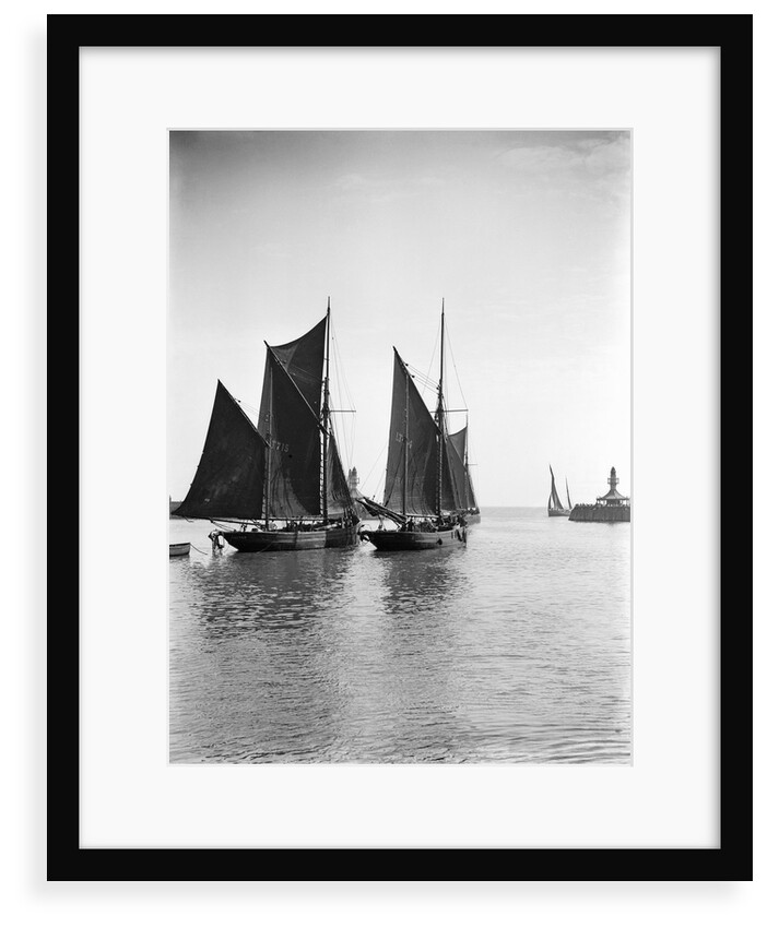 The trawler 'Refuge' (1896) [LT715] under sail, close to the trawler 'Greyhound' (1905) [LT404], in the outer harbour outward bound at Lowestoft, Suffolk by Smiths Suitall Ltd.