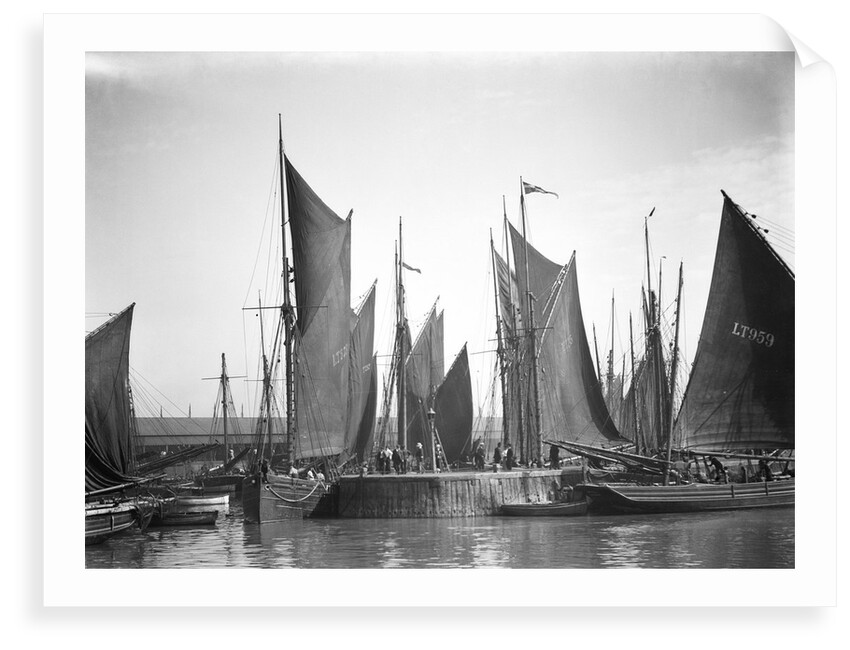 A view across Lowestoft harbour to the entrance of the trawl basin in the morning by Smiths Suitall Ltd.