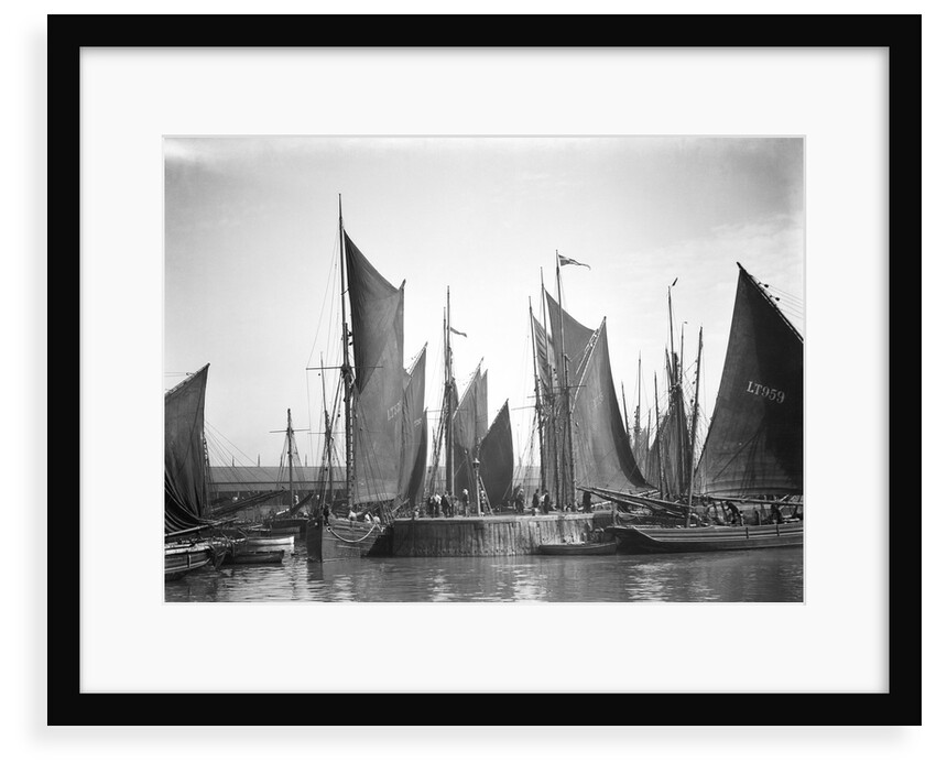 A view across Lowestoft harbour to the entrance of the trawl basin in the morning by Smiths Suitall Ltd.