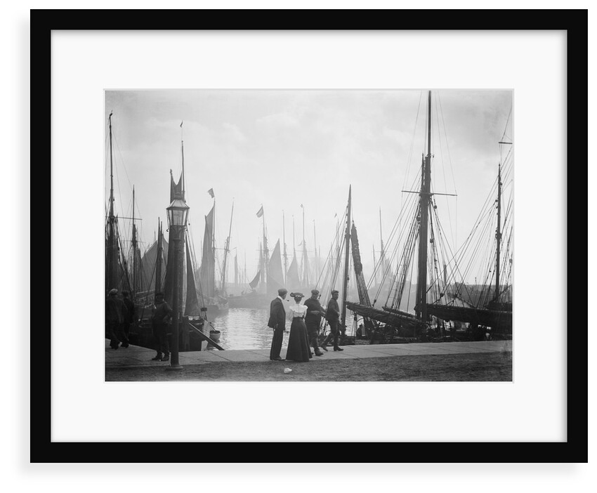 Trawlers berthed in the outer harbour with the morning mist rising at Lowestoft, Suffolk by Smiths Suitall Ltd.