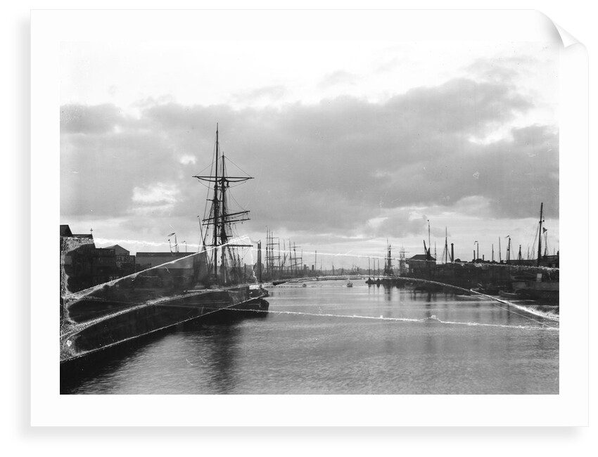 A view of the inner harbour at sunset from the harbour entrance west of the road bridge at Lowestoft, Suffolk by Smiths Suitall Ltd.