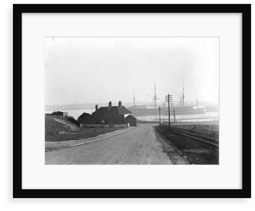 A view looking over the foreshore of Shotley Gate across the River Stour towards Harwich with the Bristol Arms on the left and the 'Ganges' training ships by Smiths Suitall Ltd.