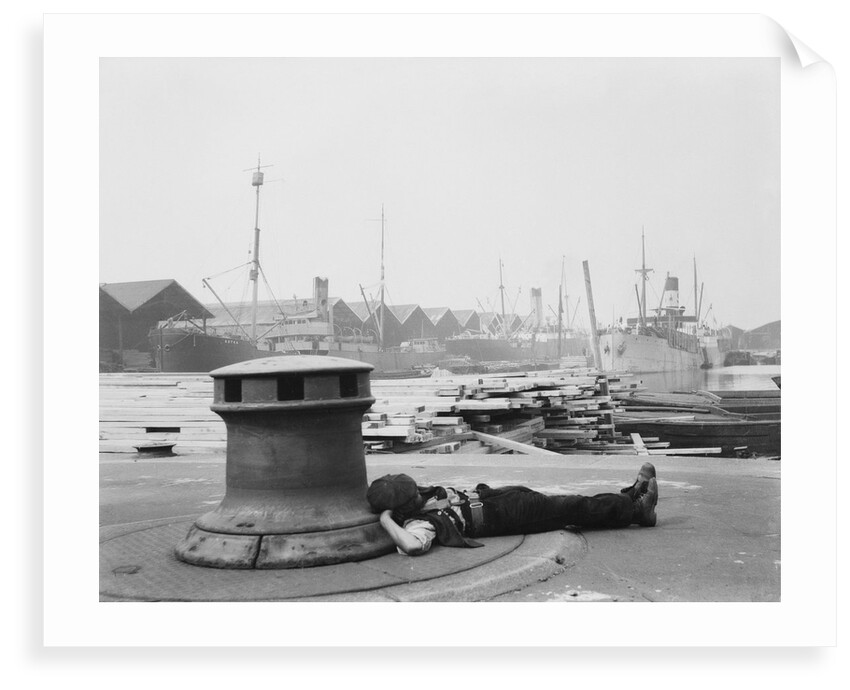 Man resting at Surrey Commercial Docks by unknown