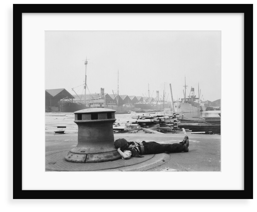 Man resting at Surrey Commercial Docks by unknown