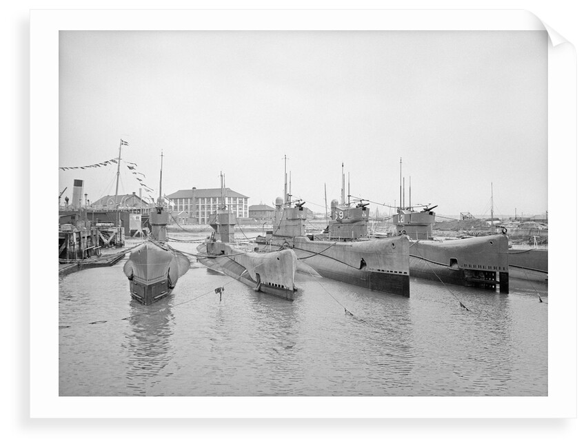 HMS Submarine 'L71' (1919), berthed at HMS 'Dolphin', Haslar Creek, with 'L56' (1919) and 'L53' (1919) inboard and 'L69' (1918) and 'L21' (1919) outboard by Unknown