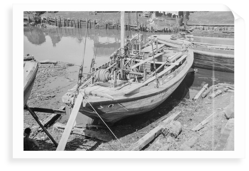 A Twaqo type junk dried out on shore at Singapore by David Watkin Waters