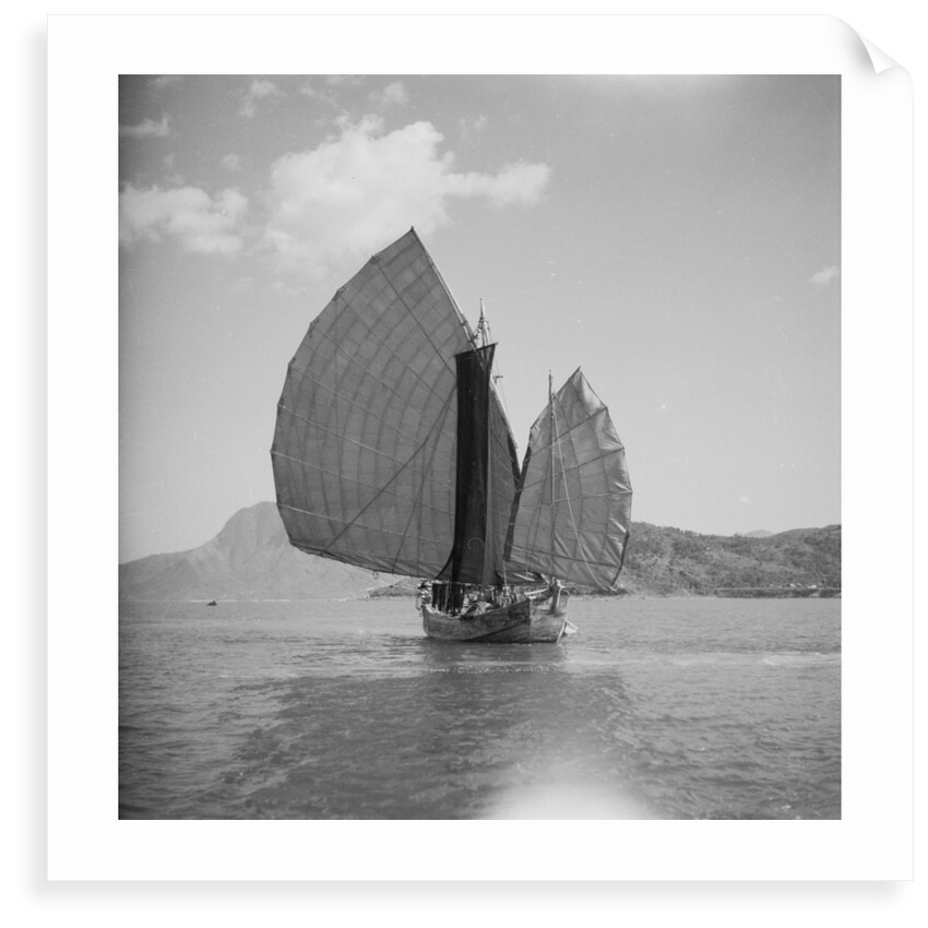 A starboard bow view of a fishing junk drifting in Tolo Harbour, Hong Kong by David Watkin Waters