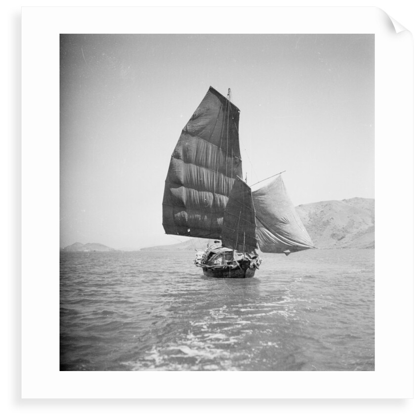 A bow view of a cargo sampan under sail in Tolo Harbour, Hong Kong by David Watkin Waters