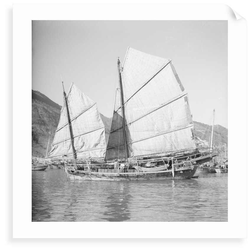 An Aberdeen fisher type junk under sail in Hong Kong harbour. by David Watkin Waters