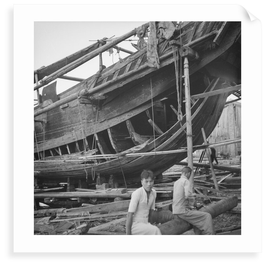 A close port side view of a Hong Kong fisher d.w. type junk repairing on a slipway at Hong Kong by David Watkin Waters