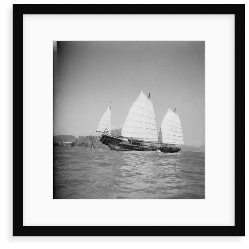 A starboard side view of a Hong Kong fisher d.w. type junk under sail at Hong Kong by David Watkin Waters