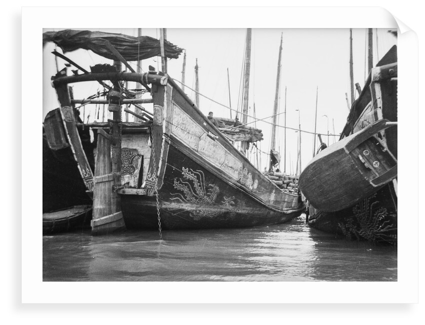 A starboard quarter view of an Hangchow Bay trader type junk moored with other junks at Shanghai by David Watkin Waters