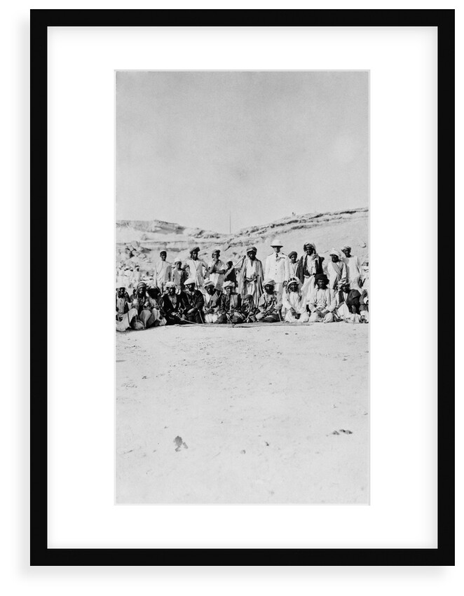 The Senior Naval Officer, Persian Gulf standing between the Sheikh of Dubai and the Sheikh of Henjam with their entourages. by unknown