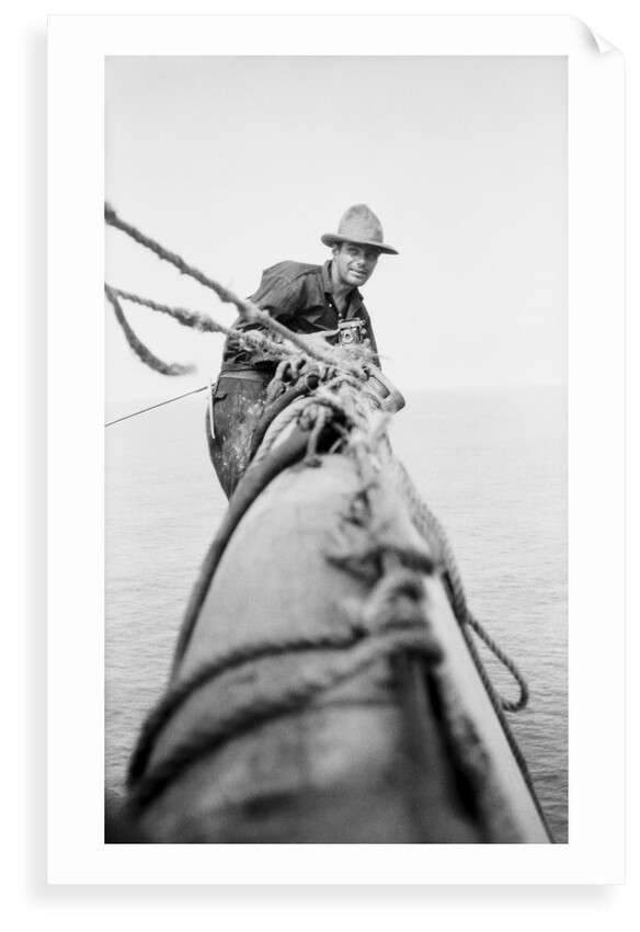 Seaman and photographer Alan Villiers on a yard with camera by unknown