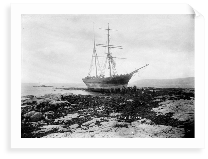 A starboard bow view of the brigantine Henry Harvey (1857) aground by Gibson & Sons of Scilly