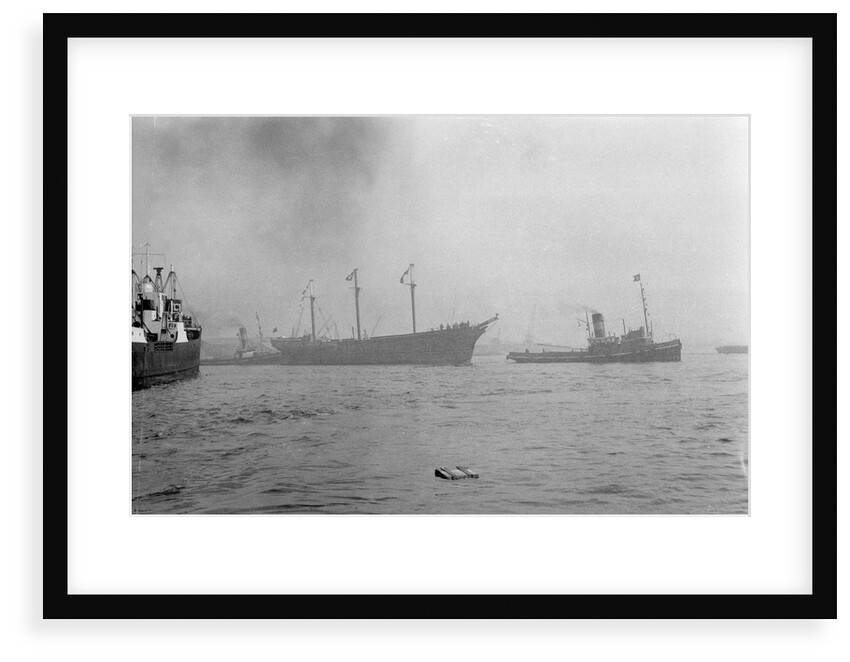 The clipper ship 'Cutty Sark' (1869) being towed from the East India Dock to Greenwich by the tug 'Gondia' (1927) by unknown