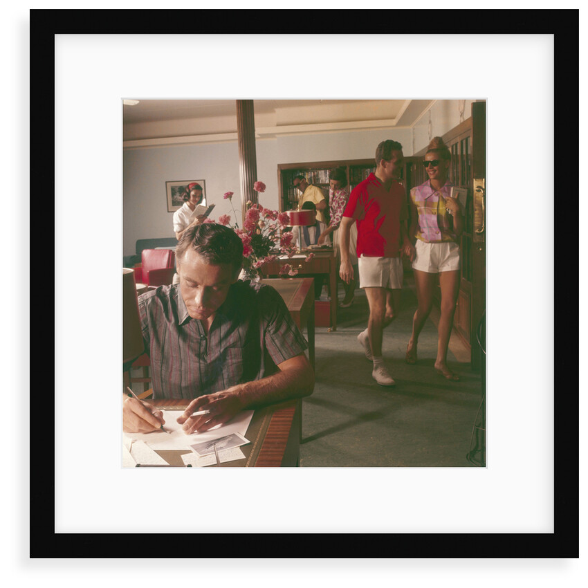 Passengers on board an unspecified cruiser liner pass the time by writing and walking the ship by Marine Photo Service