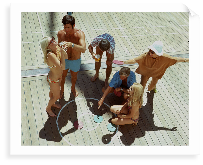 A group of passengers aboard an unspecified cruise ship enjoy a game of deck quoits by Union Castle Line Collection