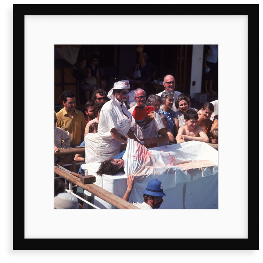 Macabre comic entertainment aboard an unspecified cruise ship - perhaps a variant of the Crossing the Line (the Equator) ceremony? by Marine Photo Service